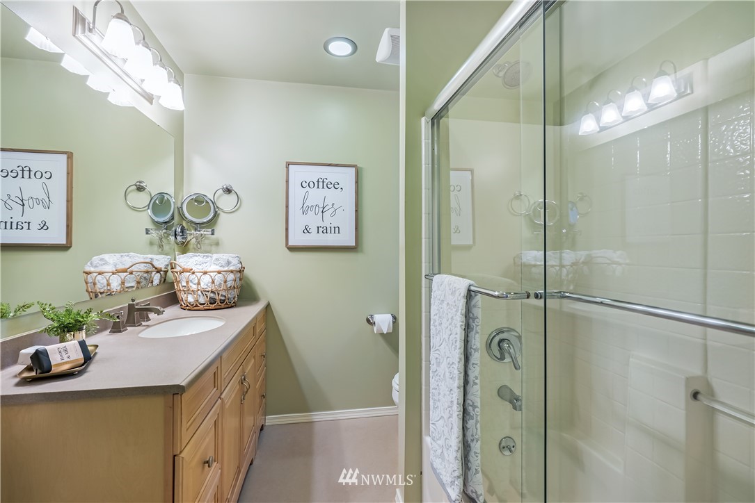 1817 Southwest Lake Roesiger Road Snohomish, WA 98290 - Photo 21 of 37 a bathroom with a double vanity sink mirror and shower