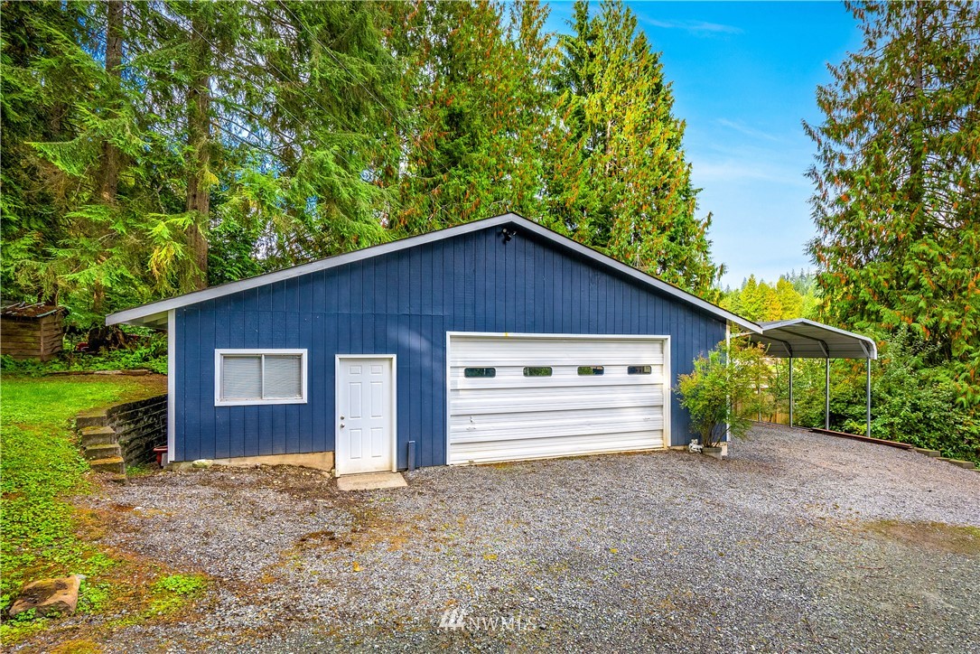 1817 Southwest Lake Roesiger Road Snohomish, WA 98290 - Photo 34 of 37 a view of a house with a yard and garage