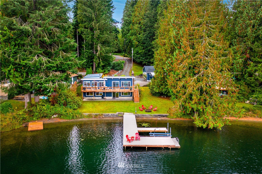 1817 Southwest Lake Roesiger Road Snohomish, WA 98290 - Photo 7 of 37 a view of swimming pool with lawn chairs and a yard