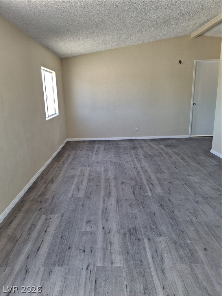 4550 Horn Road Pahrump, NV 89048 - Photo 6 of 12 This interior space showcases sleek, horizontally planked flooring and a streamlined wall-mounted window.