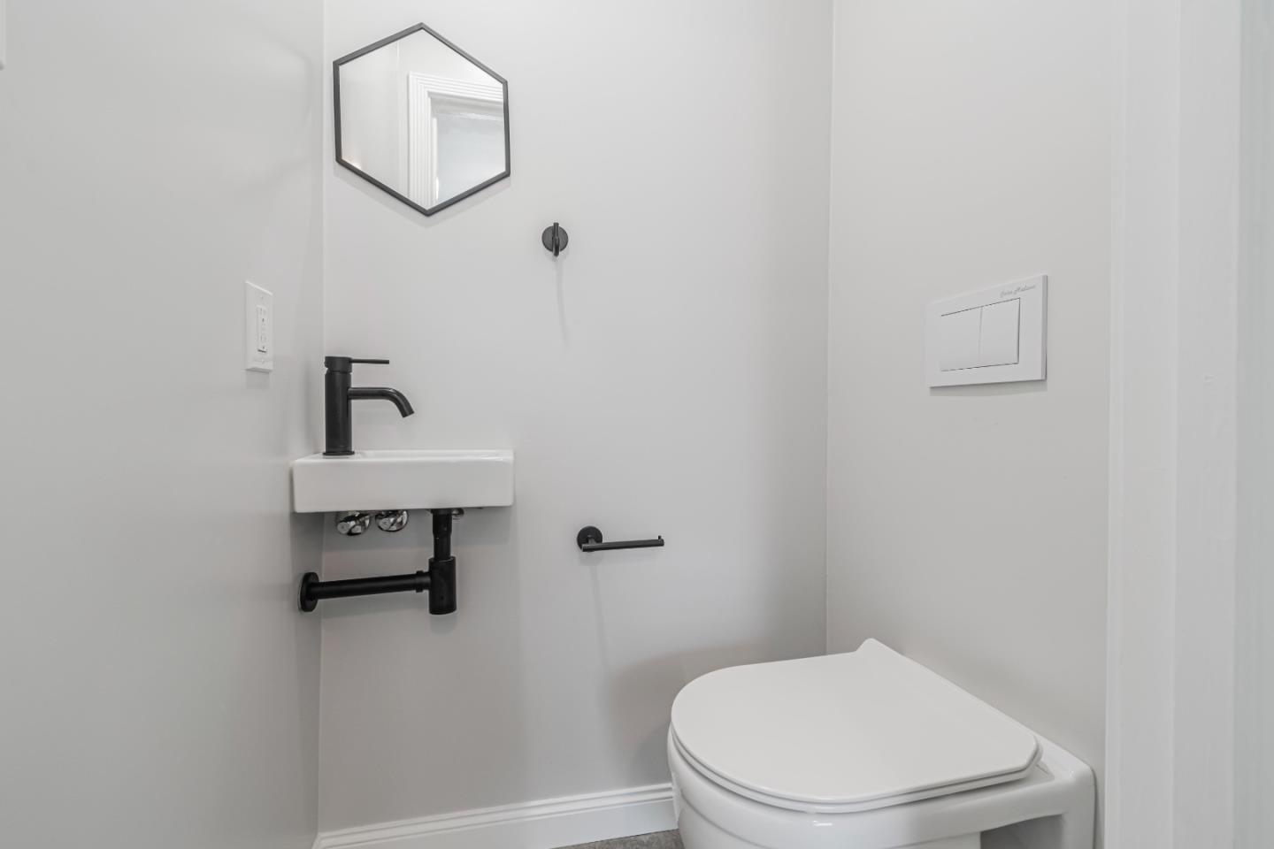 843 Beechwood Drive Daly City, CA 94015 - Photo 18 of 25 a white toilet sitting next to a shower