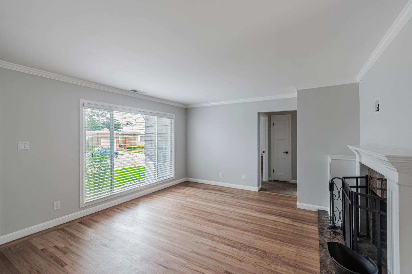 843 Beechwood Drive Daly City, CA 94015 - Photo 4 of 25 wooden floor in an empty room with a window