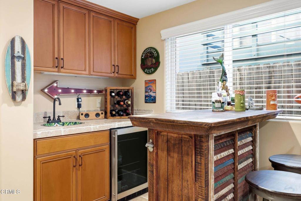 137 Fillmore Avenue Oxnard, CA 93035 - Photo 11 of 73 a kitchen with stainless steel appliances granite countertop a sink a stove and a wooden cabinets