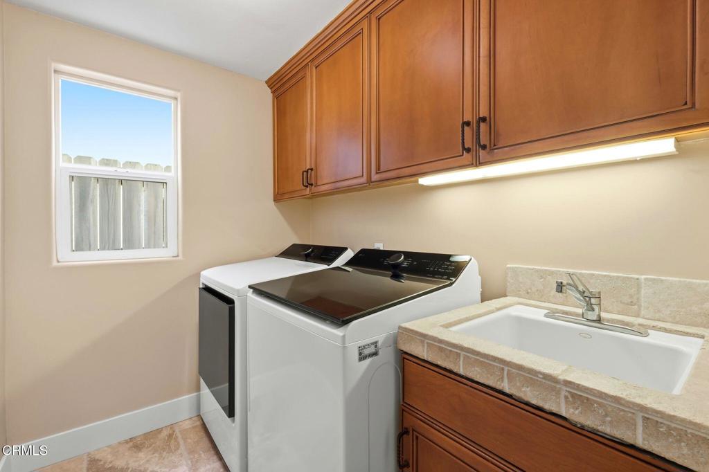137 Fillmore Avenue Oxnard, CA 93035 - Photo 14 of 73 a utility room with sink dryer and washer