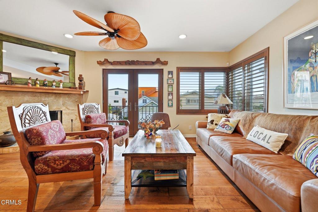 137 Fillmore Avenue Oxnard, CA 93035 - Photo 18 of 73 a living room with furniture a flat screen tv and a large window
