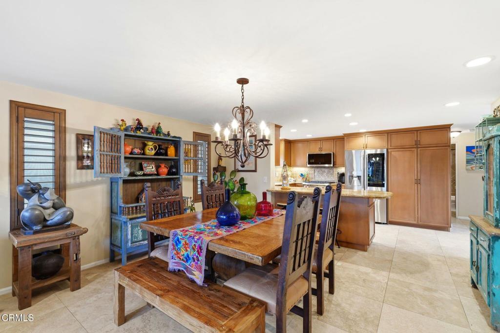 137 Fillmore Avenue Oxnard, CA 93035 - Photo 23 of 73 a dining room with furniture and a kitchen view
