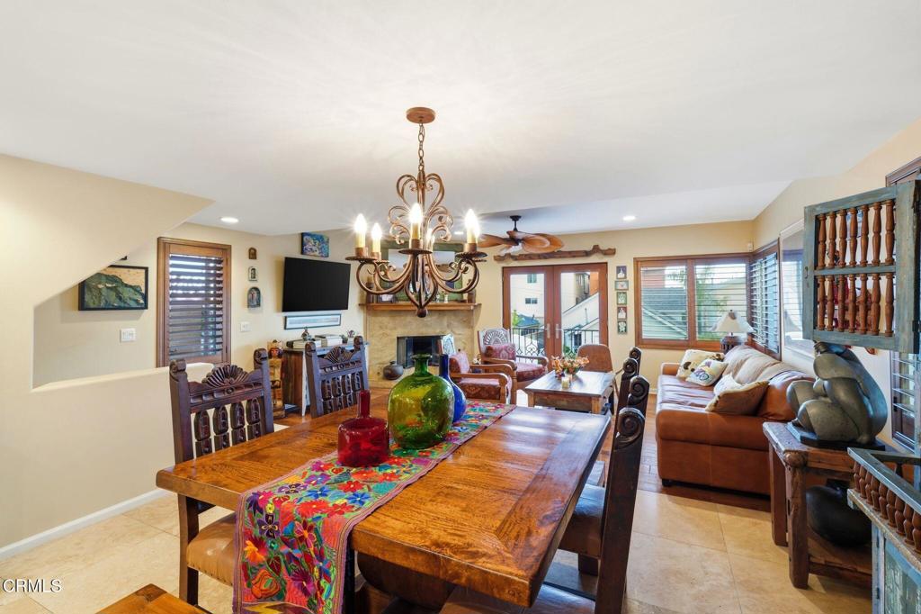 137 Fillmore Avenue Oxnard, CA 93035 - Photo 25 of 73 a view of a dining room with furniture a chandelier and wooden floor