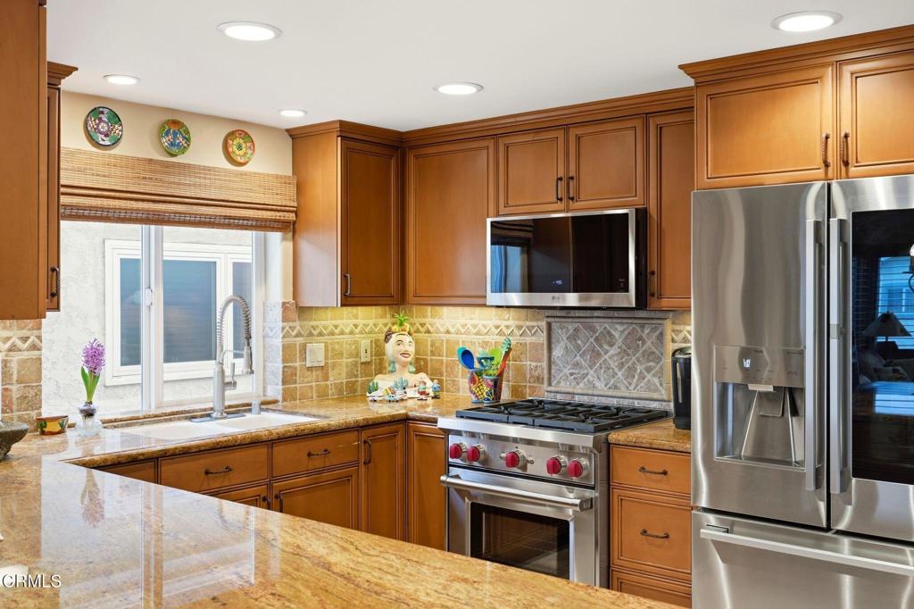 137 Fillmore Avenue Oxnard, CA 93035 - Photo 26 of 73 a kitchen with stainless steel appliances granite countertop a stove microwave and refrigerator