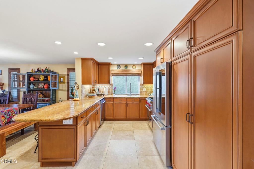 137 Fillmore Avenue Oxnard, CA 93035 - Photo 28 of 73 a bathroom with a tub a window and bookshelf