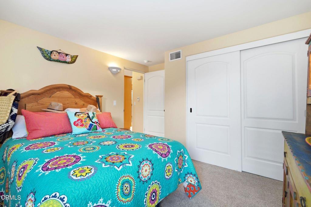 137 Fillmore Avenue Oxnard, CA 93035 - Photo 33 of 73 a bedroom with a bed and a dresser in it