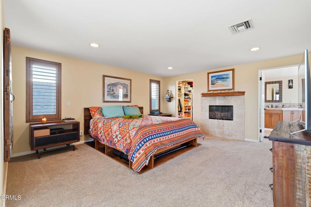 137 Fillmore Avenue Oxnard, CA 93035 - Photo 38 of 73 a spacious bedroom with a bed and a couch