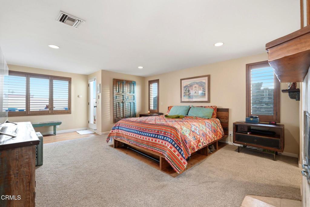 137 Fillmore Avenue Oxnard, CA 93035 - Photo 39 of 73 a spacious bedroom with a bed and wooden floor