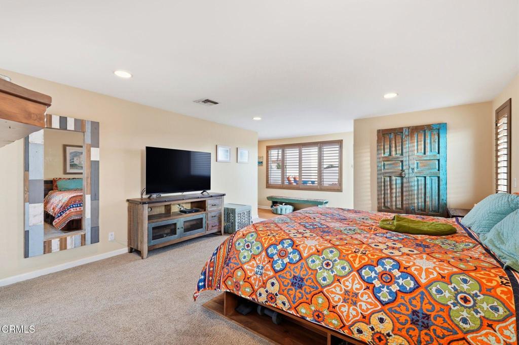 137 Fillmore Avenue Oxnard, CA 93035 - Photo 40 of 73 a bedroom with a bed and a flat screen television