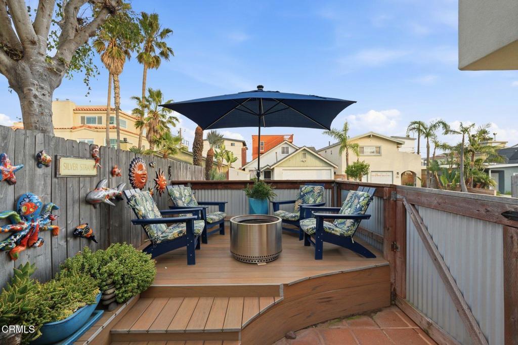 137 Fillmore Avenue Oxnard, CA 93035 - Photo 4 of 73 a view of a patio with table and chairs potted plants