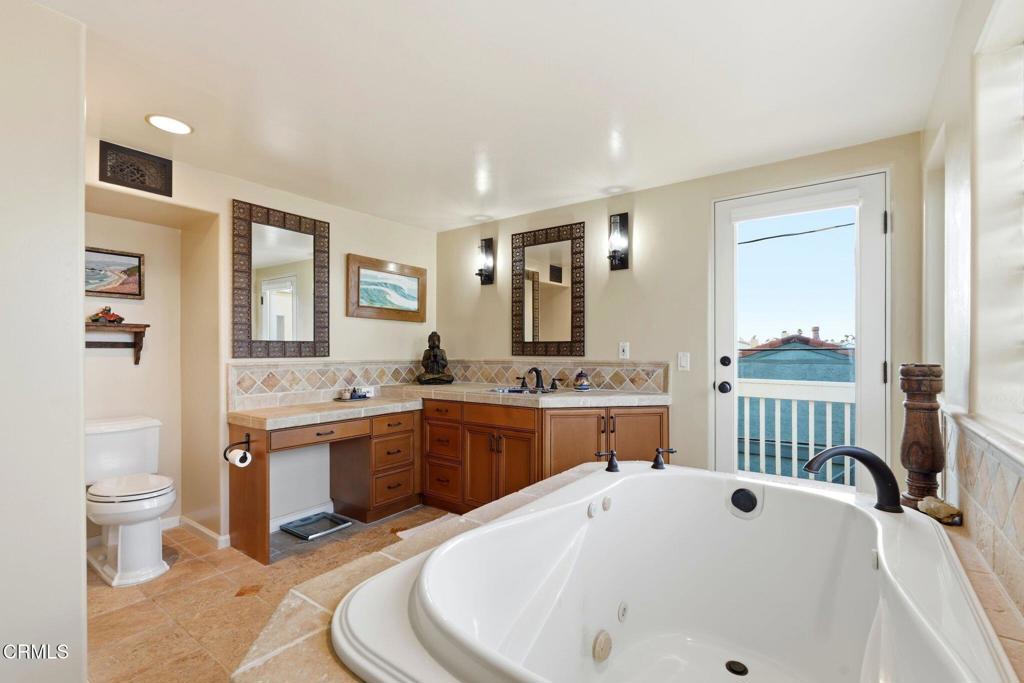 137 Fillmore Avenue Oxnard, CA 93035 - Photo 41 of 73 a large white bathroom with a granite countertop sink and a large mirror