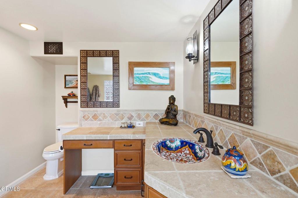 137 Fillmore Avenue Oxnard, CA 93035 - Photo 45 of 73 a bathroom with a sink and a mirror