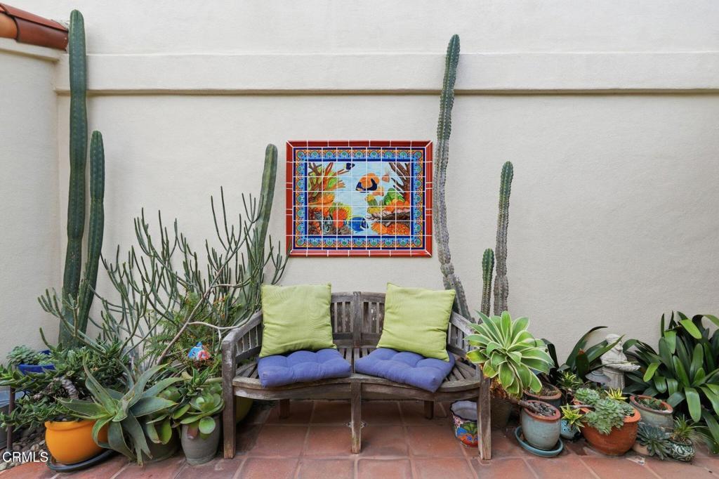 137 Fillmore Avenue Oxnard, CA 93035 - Photo 6 of 73 a potted plant sitting on top of a wooden floor