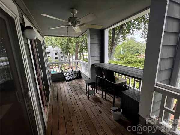a view of a living room with furniture and a large window