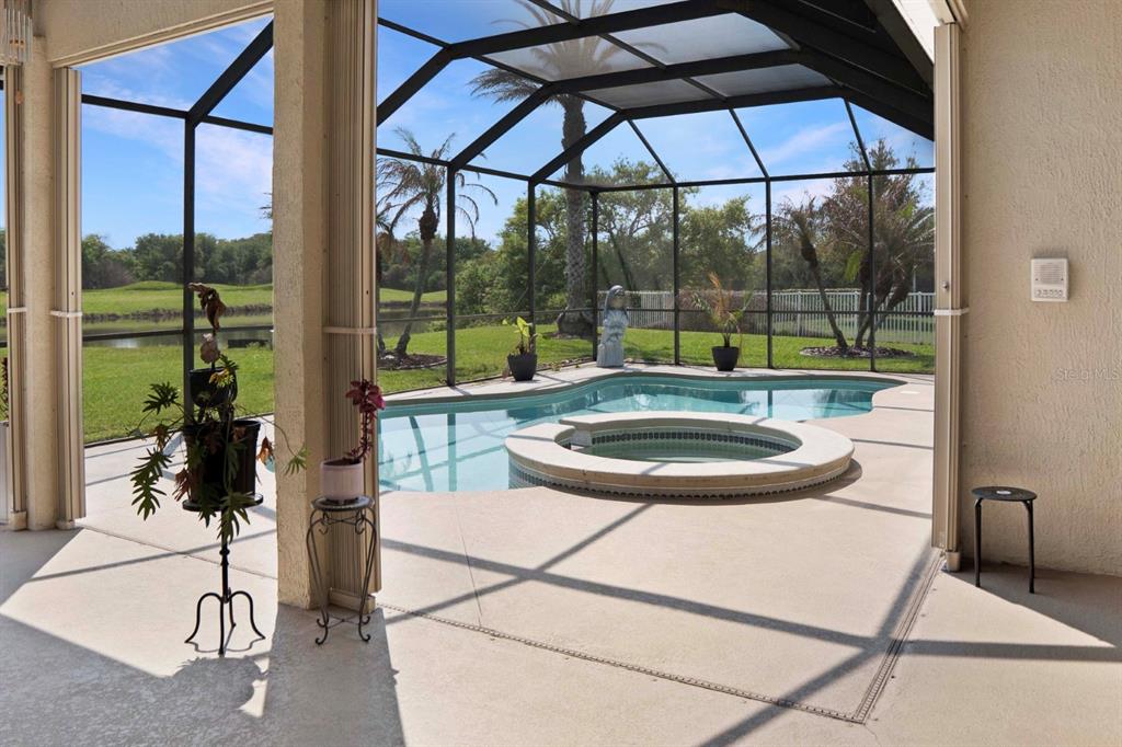215 Strathmore Circle Kissimmee, FL 34744 - Photo 17 of 24 a view of a swimming pool with a lounge chairs
