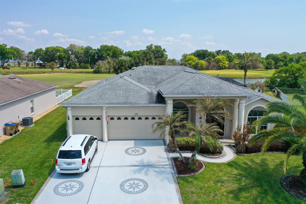215 Strathmore Circle Kissimmee, FL 34744 - Photo 21 of 24 a aerial view of a house with garden space and car parked