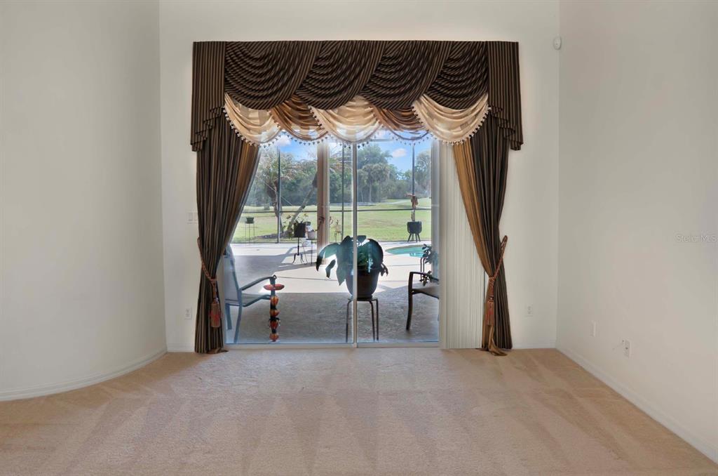 215 Strathmore Circle Kissimmee, FL 34744 - Photo 4 of 24 a view of a couches and table in a room