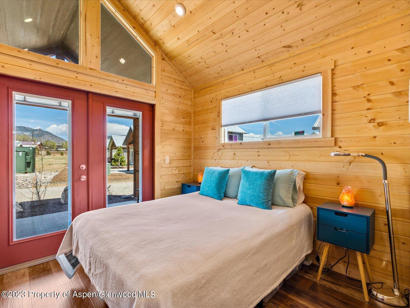 329 River Frontage Road, Unit 8 Silt, CO 81652 - Photo 12 of 24 a large bedroom with a bed and wooden floor