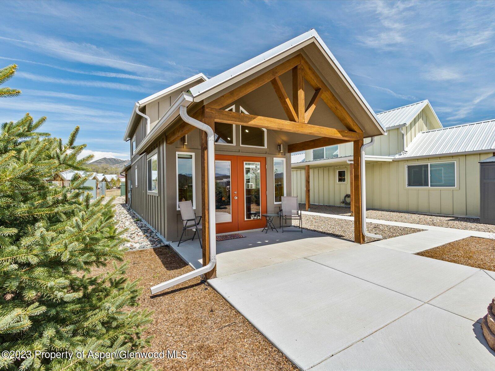 329 River Frontage Road, Unit 8 Silt, CO 81652 - Photo 3 of 24 a front view of a house with garden