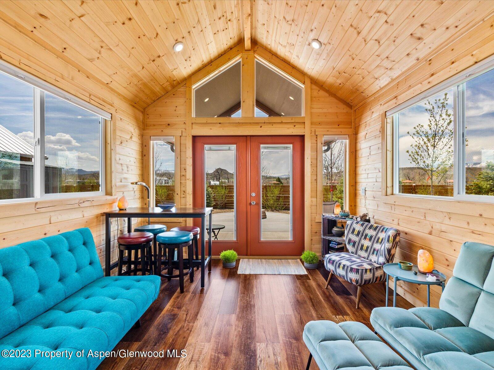 329 River Frontage Road, Unit 8 Silt, CO 81652 - Photo 7 of 24 a outdoor living space with furniture and a large window
