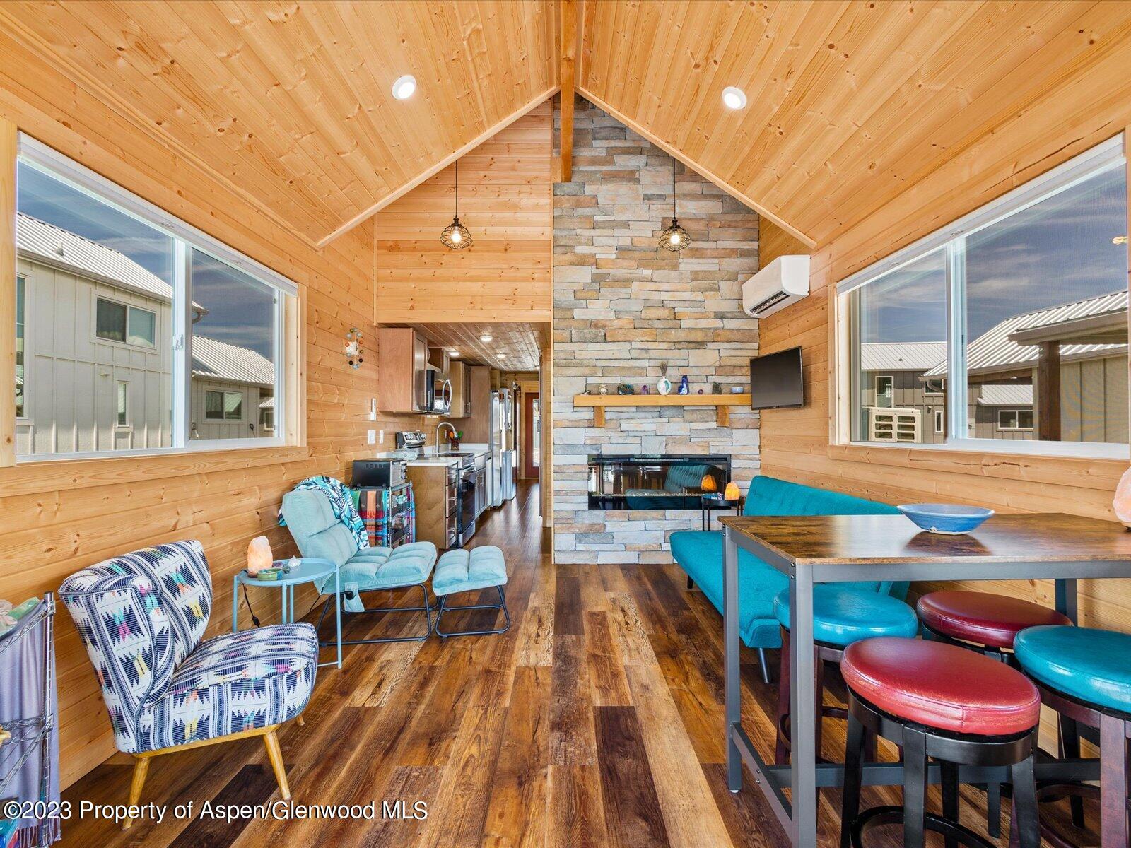 329 River Frontage Road, Unit 8 Silt, CO 81652 - Photo 8 of 24 a outdoor space with patio the couches and a dining table with chairs