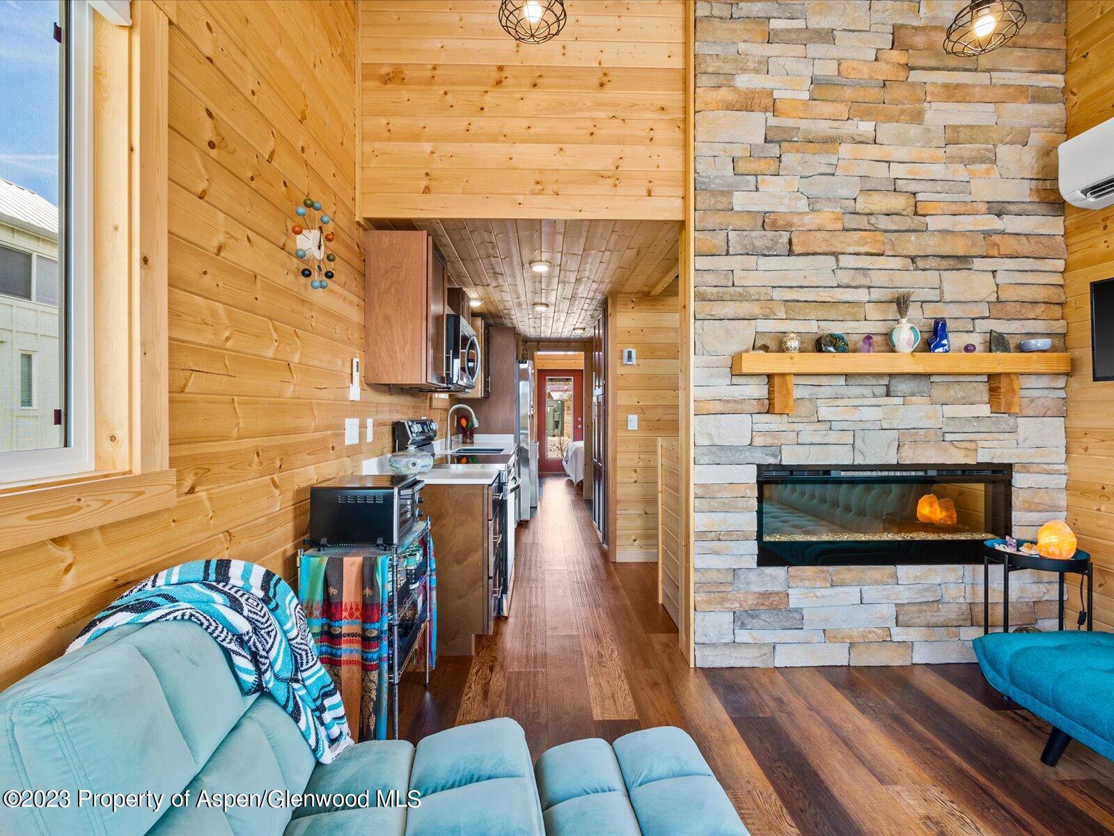 329 River Frontage Road, Unit 8 Silt, CO 81652 - Photo 9 of 24 a living room with furniture and a fireplace