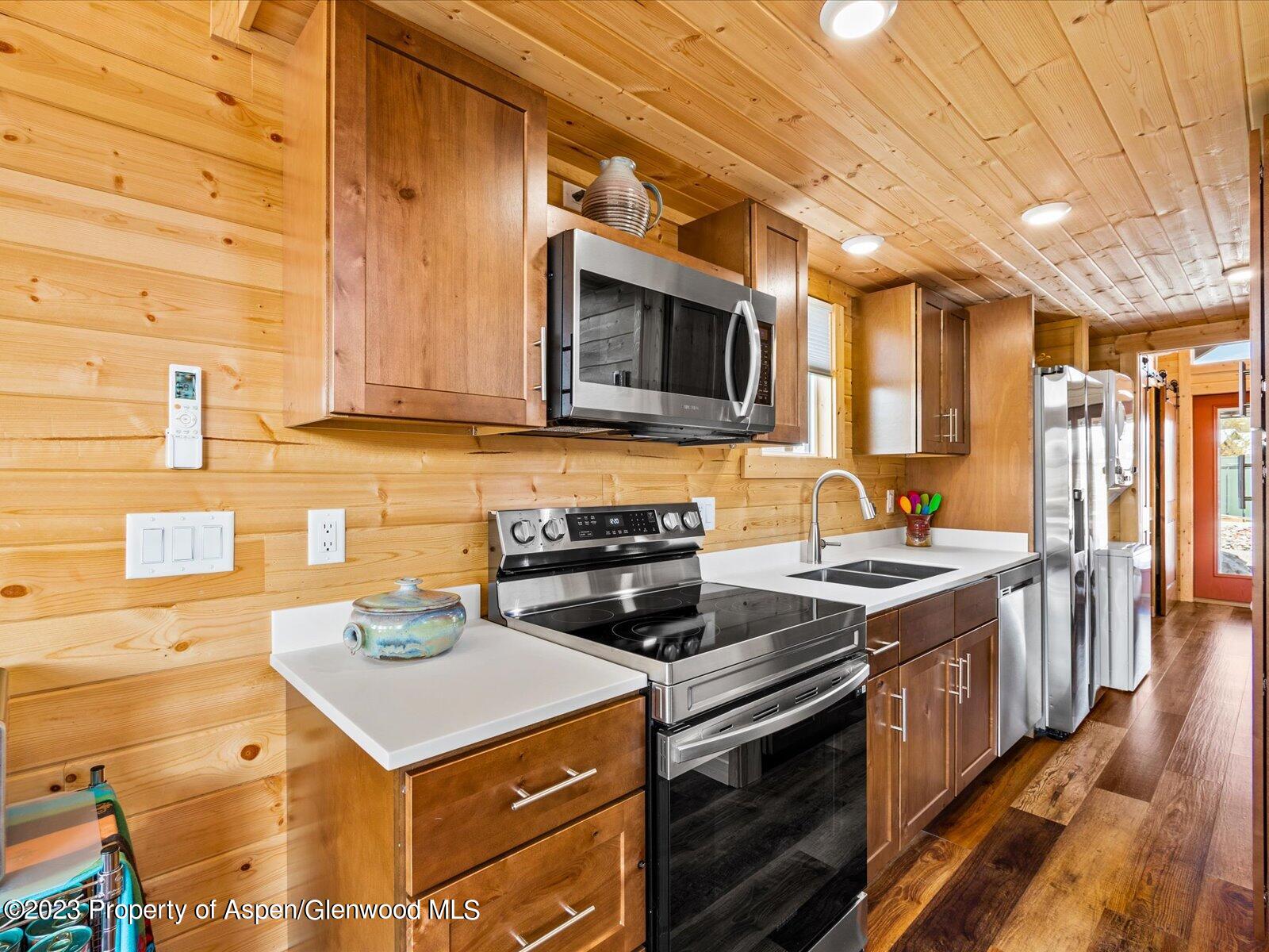 329 River Frontage Road, Unit 8 Silt, CO 81652 - Photo 10 of 24 a kitchen with a stove and a sink
