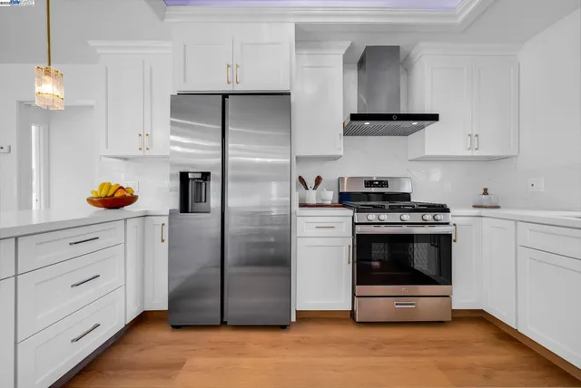 a kitchen with a stove and a sink