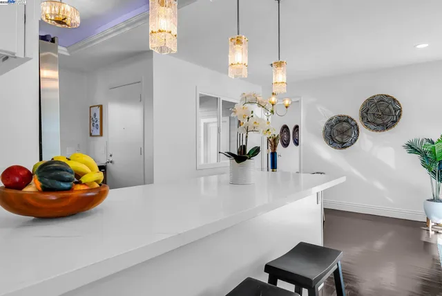 a bedroom with a bed and a painting