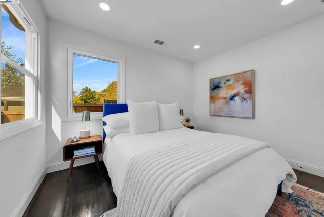 a bedroom with a bed and a couch