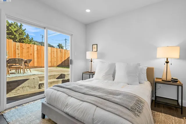 a bedroom with a bed and a table with chair