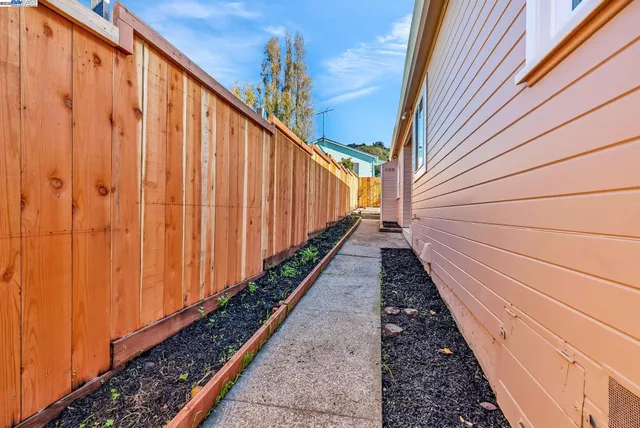 a view of a backyard patio and fire pit