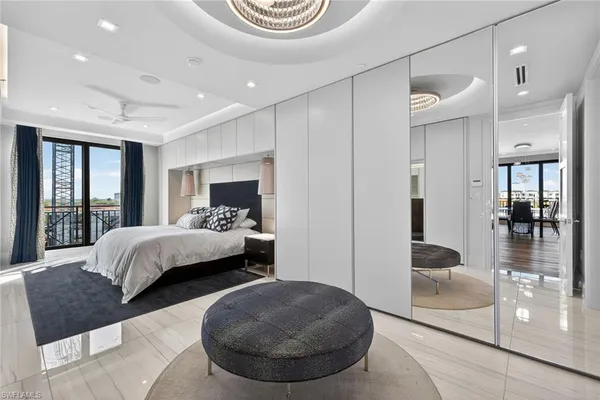 a bedroom with a large bed and a couch