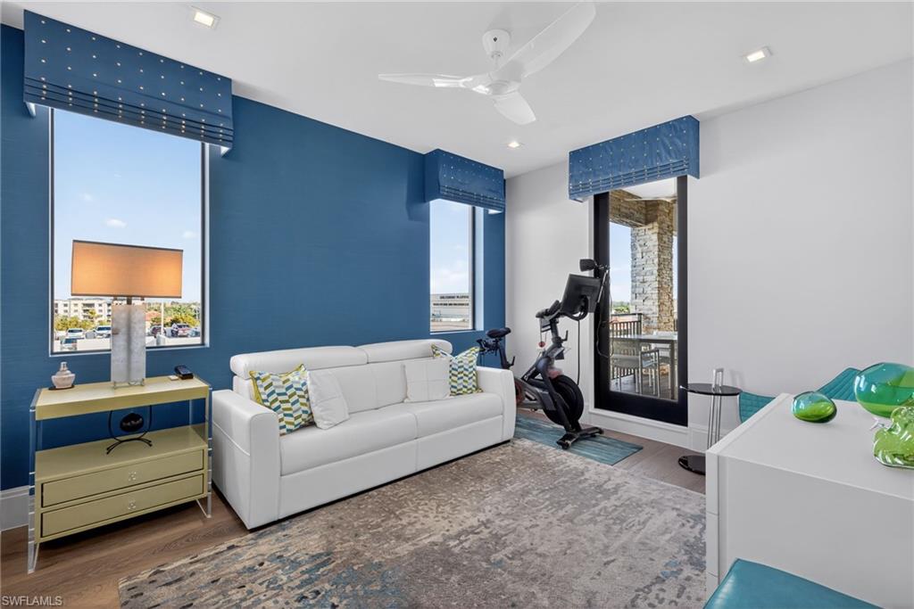 1135 3rd Avenue South, Unit 521 Naples, FL 34102 - Photo 19 of 39 a living room with furniture and a potted plant
