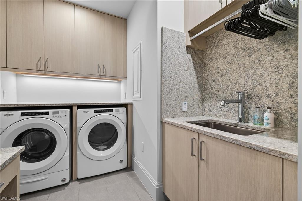 1135 3rd Avenue South, Unit 521 Naples, FL 34102 - Photo 23 of 39 a utility room with sink dryer and washer