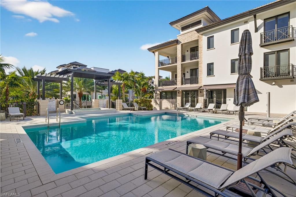 1135 3rd Avenue South, Unit 521 Naples, FL 34102 - Photo 31 of 39 a house view with a sitting space and garden space