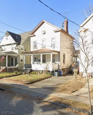 a front view of a house with swimming pool