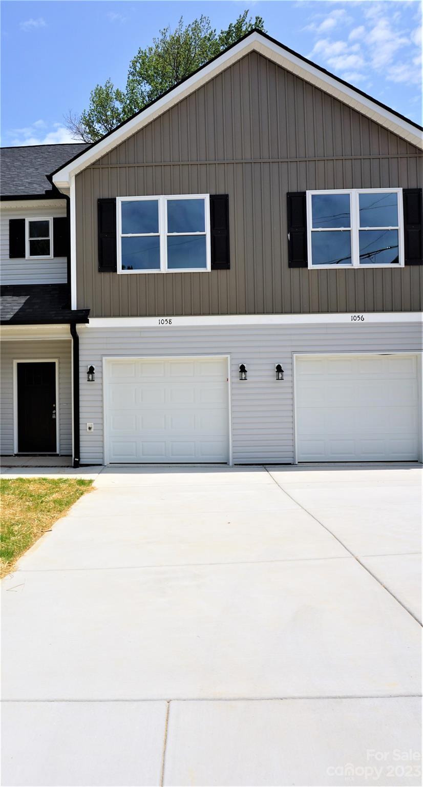 a front view of a house with garage