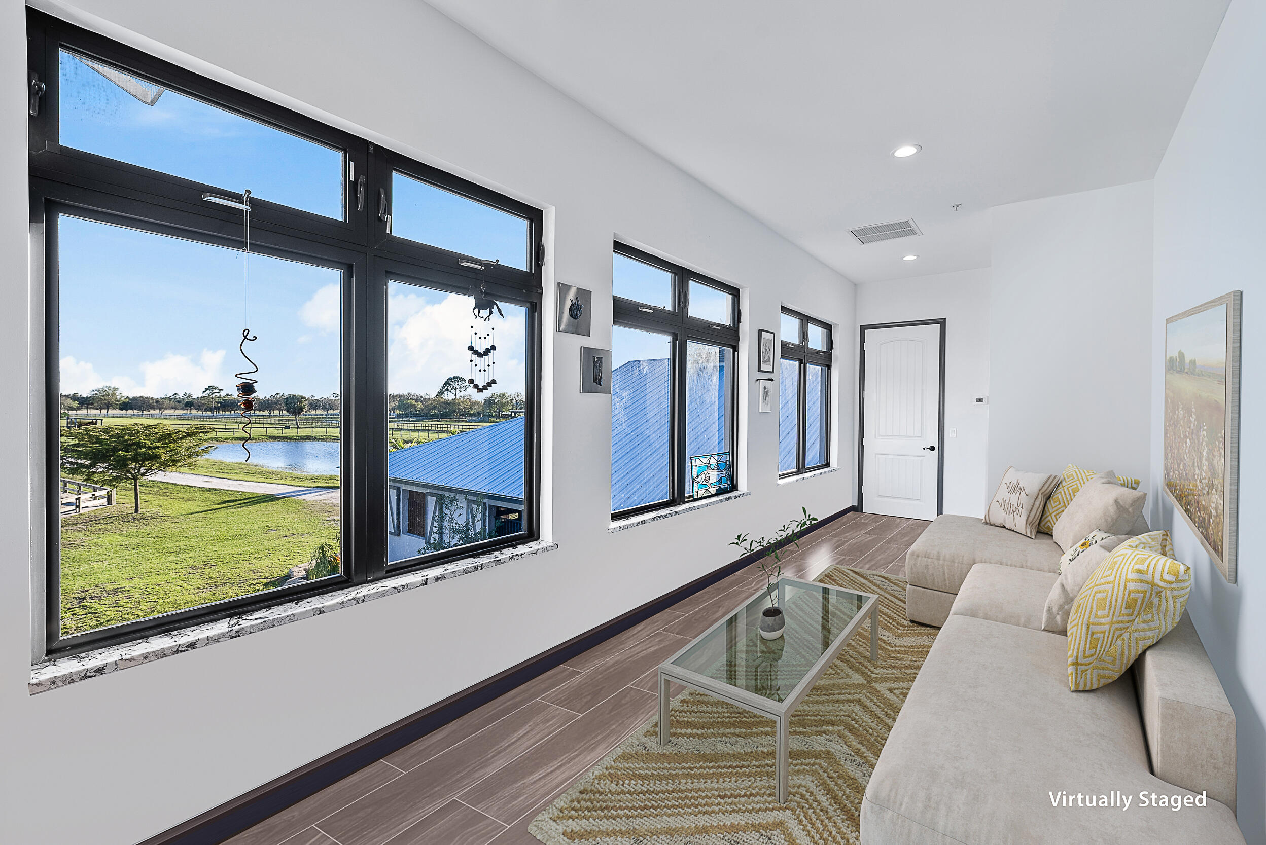 2986 Southwest Trailside Path Stuart, FL 34997 - Photo 15 of 40 a spacious bedroom with a large window and a bed
