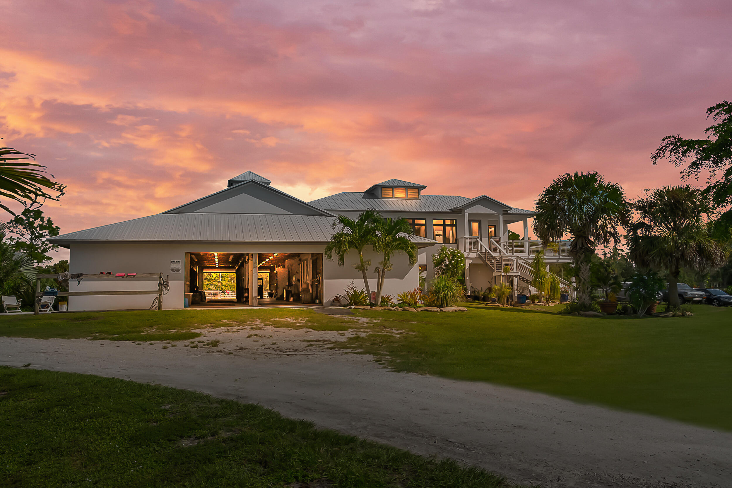 2986 Southwest Trailside Path Stuart, FL 34997 - Photo 2 of 40 a front view of a house with a garden