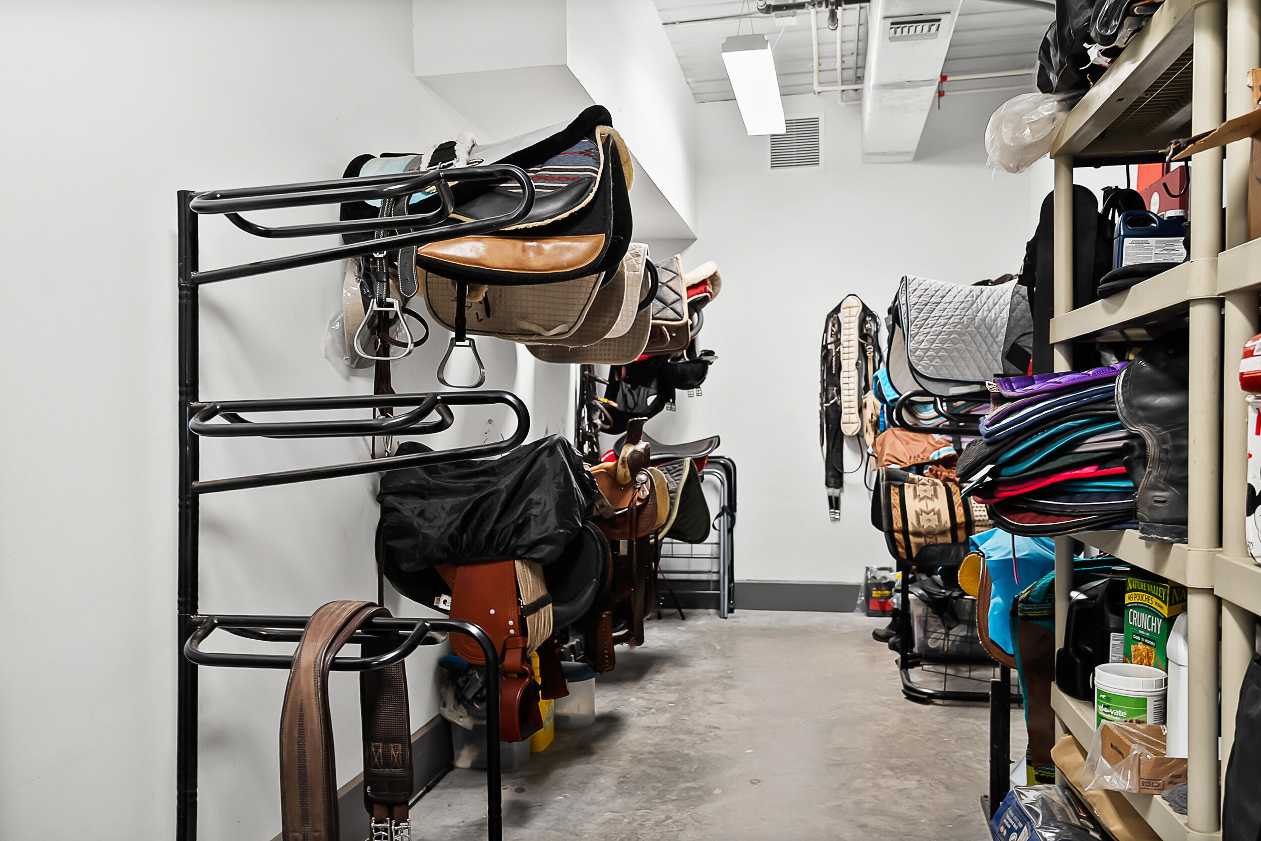 2986 Southwest Trailside Path Stuart, FL 34997 - Photo 21 of 40 a view of walk in closet with clothes and shoes