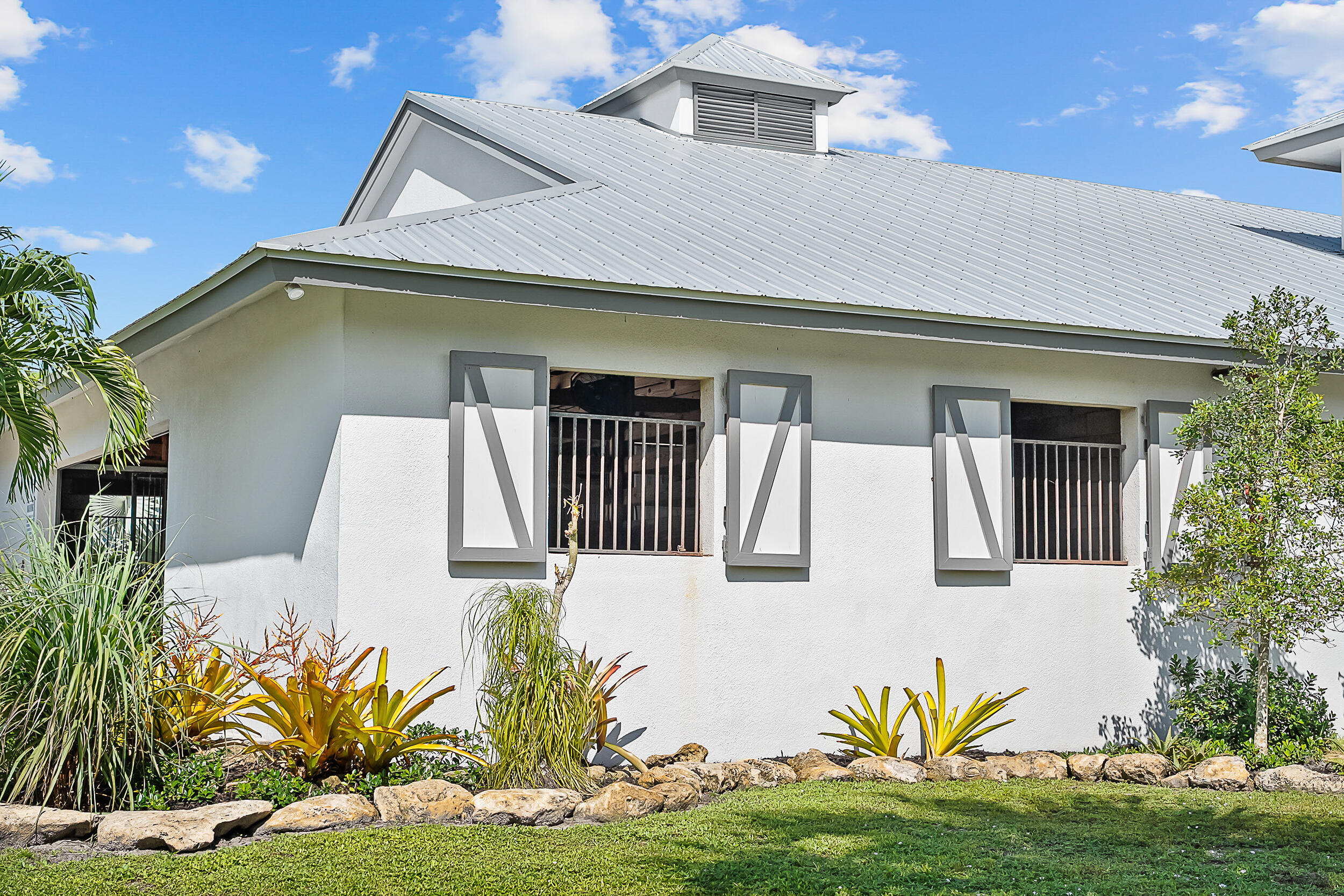2986 Southwest Trailside Path Stuart, FL 34997 - Photo 22 of 40 a front view of a house with garden
