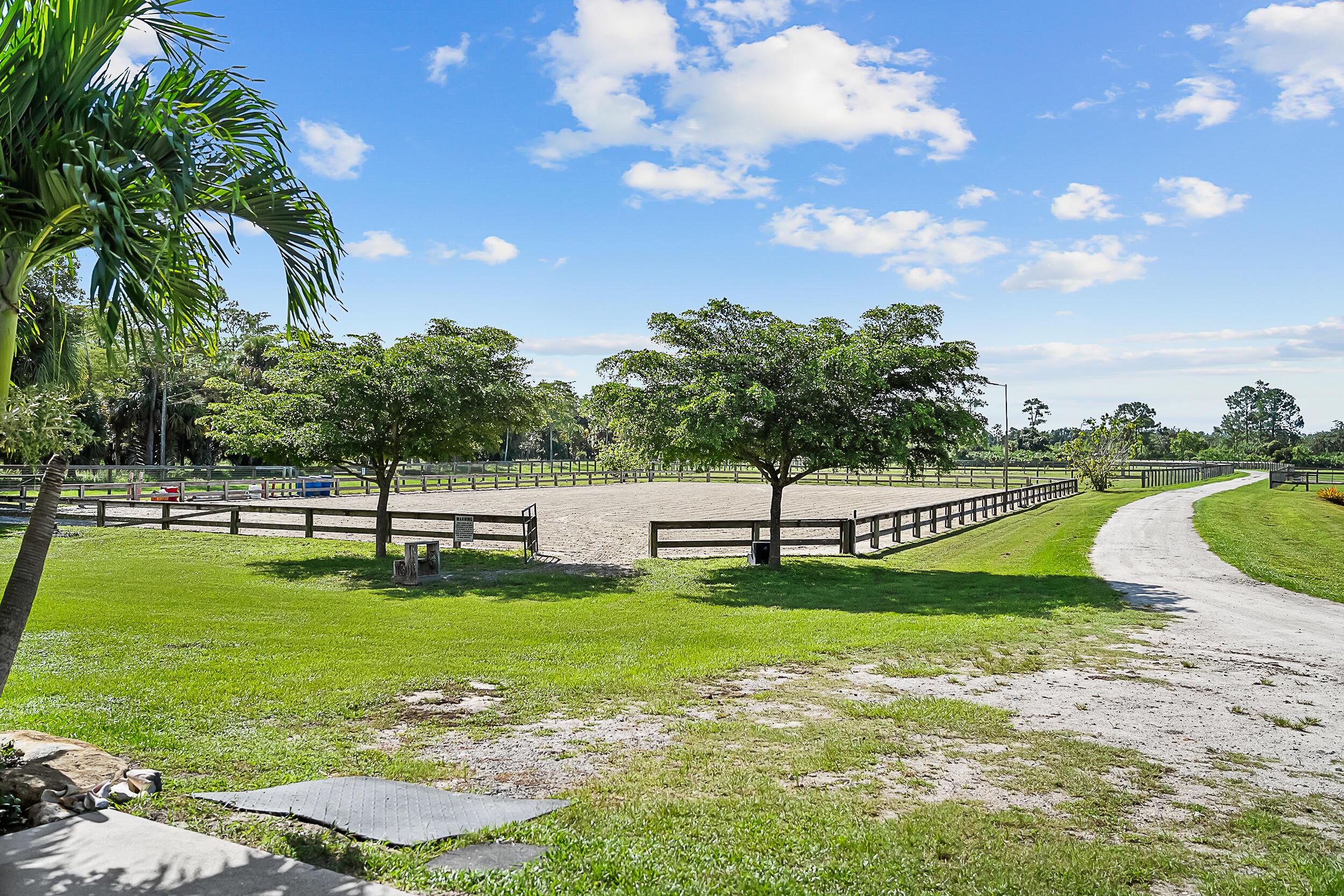 2986 Southwest Trailside Path Stuart, FL 34997 - Photo 24 of 40 a view of a swimming pool with a garden
