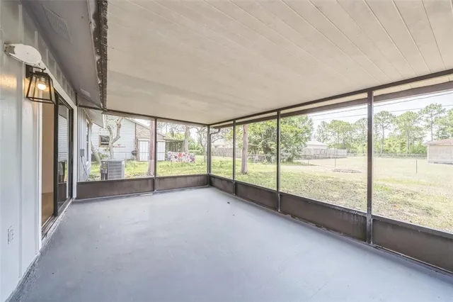 a view of an empty room with a large window