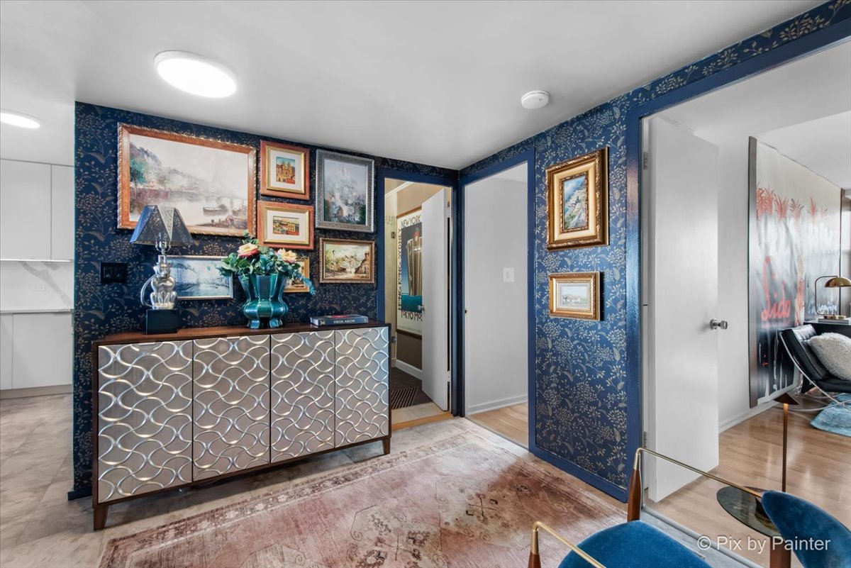 1150 North Lake Shore Drive, Unit 19A Chicago, IL 60611 - Photo 14 of 34 a living room with furniture and a flat screen tv