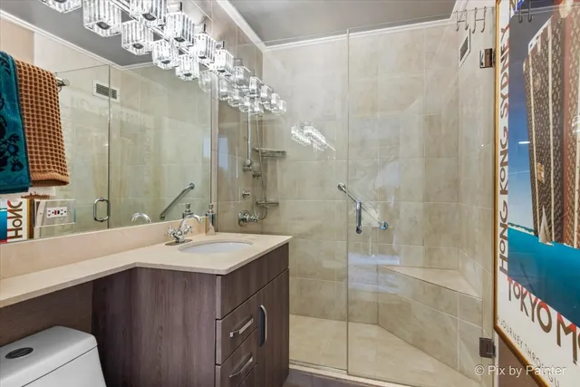 a bathroom with a sink double vanity and shower